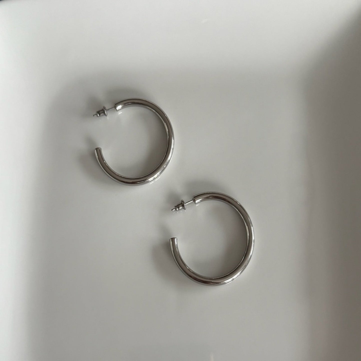open tube hoops in silver