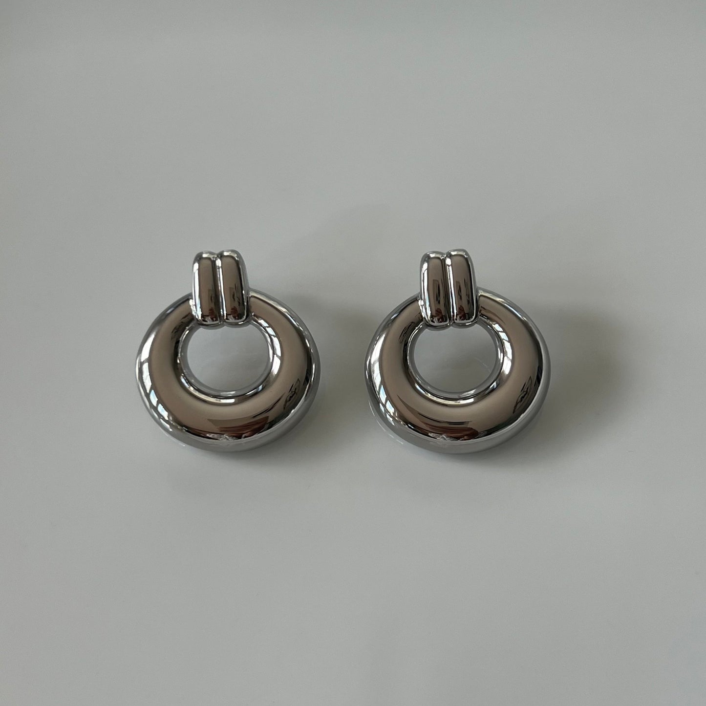 silver tone, modern circular drop earrings
