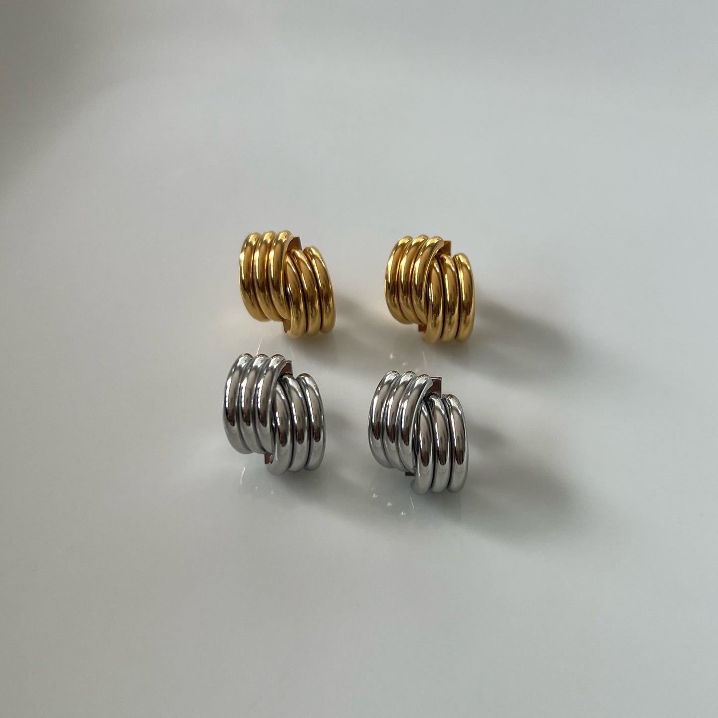 Double layer stud earrings in gold and silver