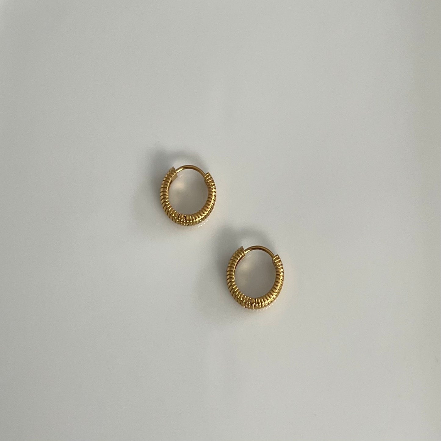 textured small hoops in gold