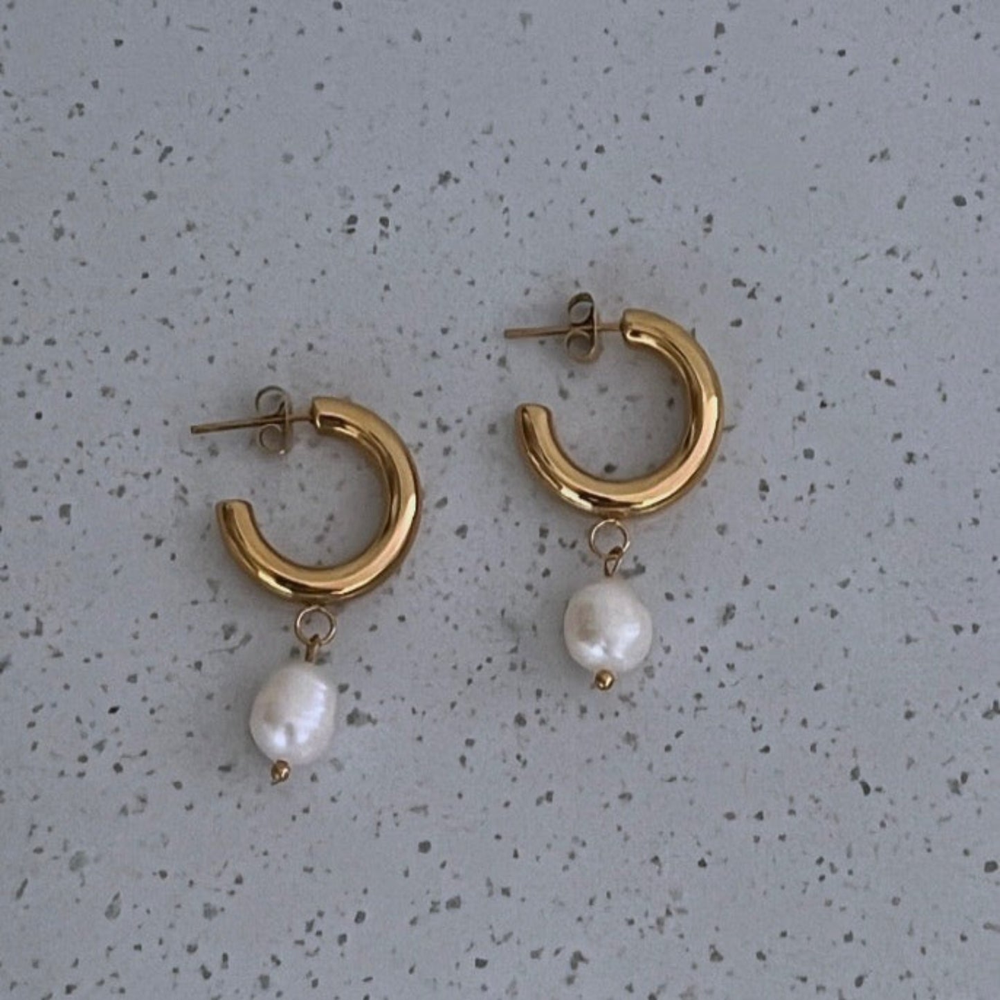 Gold C shaped hoops with fresh water pearls