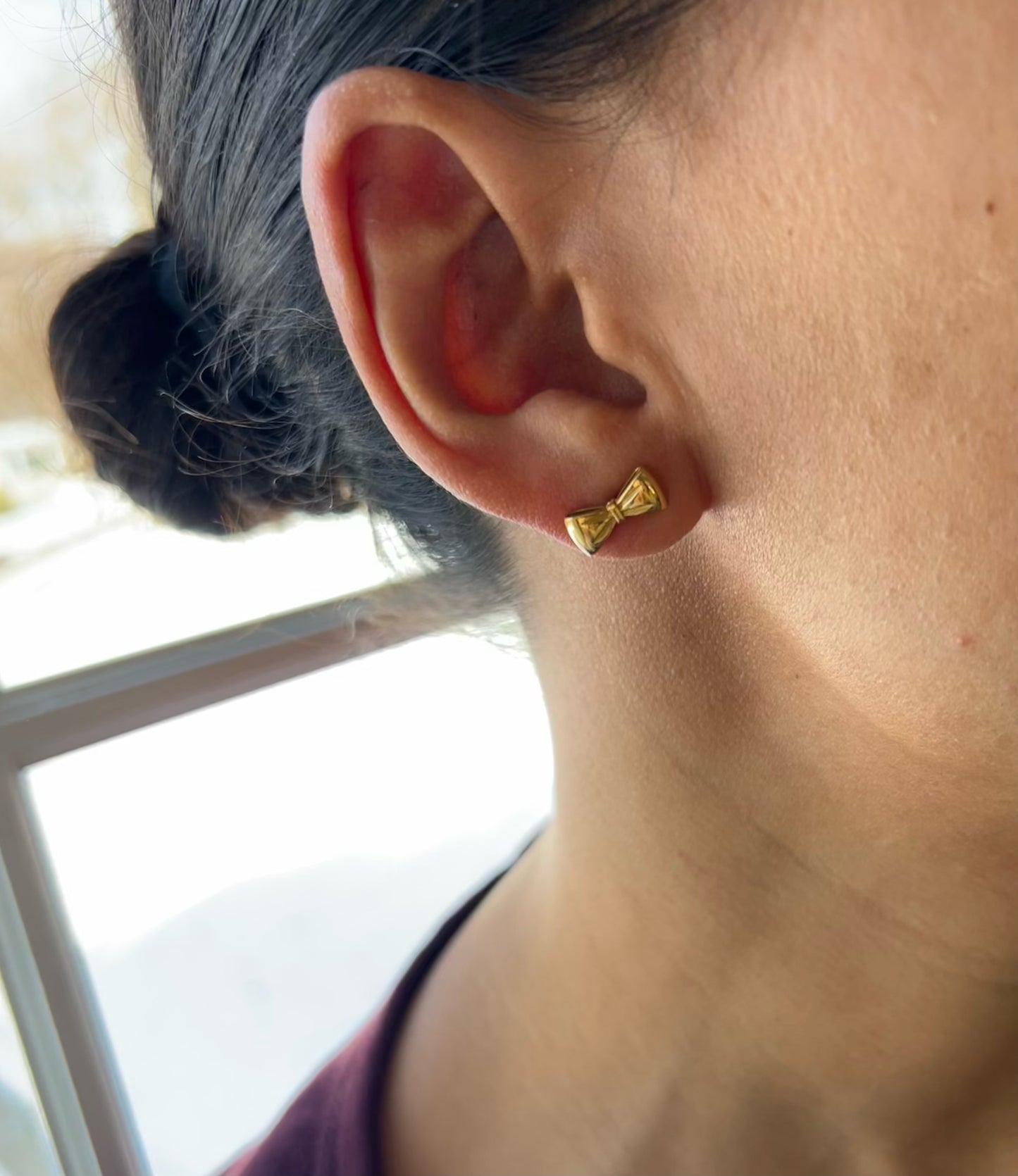 bow stud earrings in gold