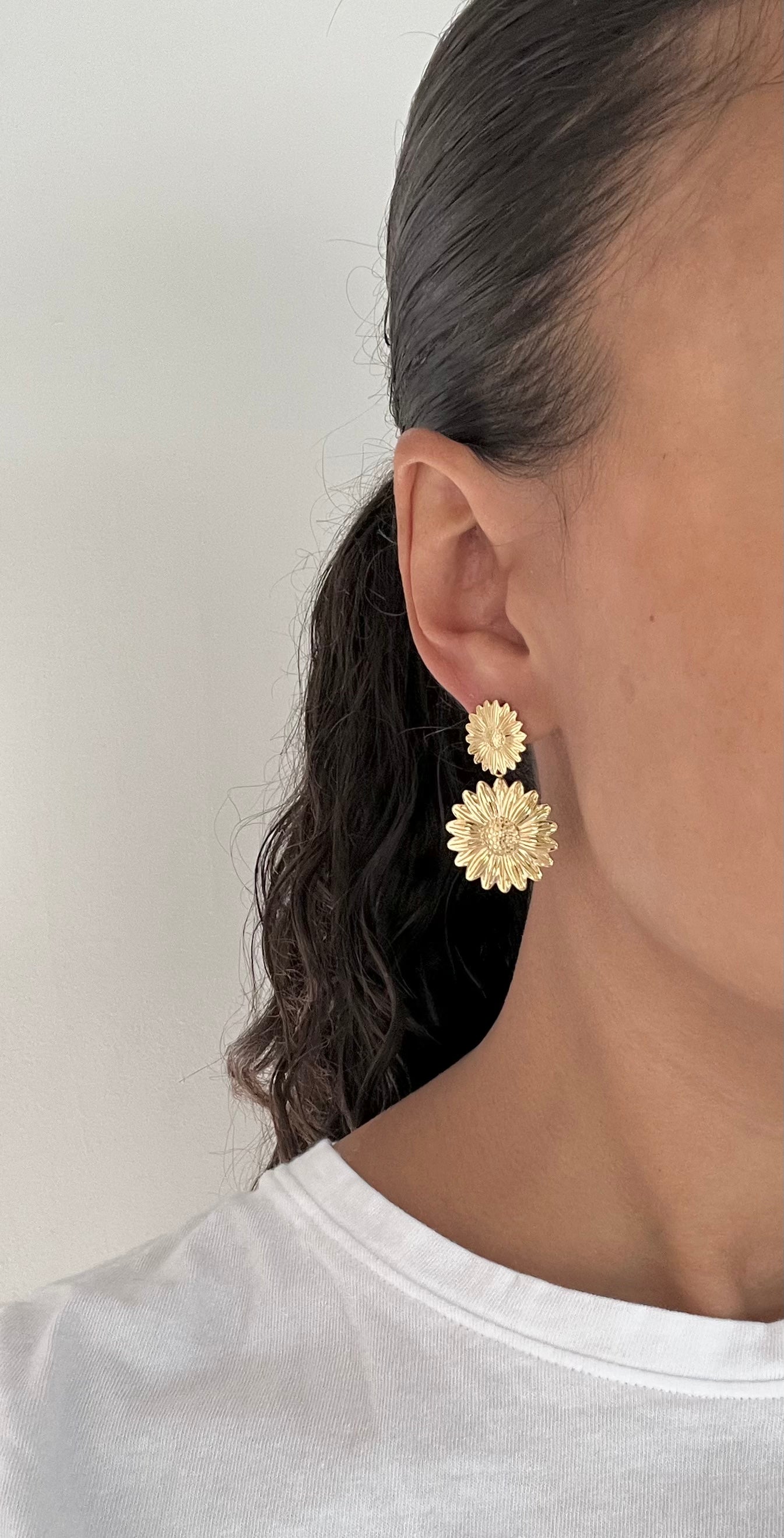 Gold flower dangle earrings