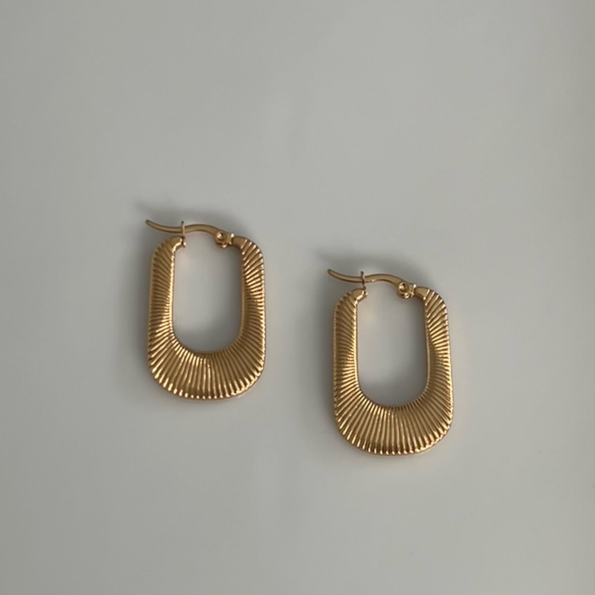 gold textured u shaped hoops