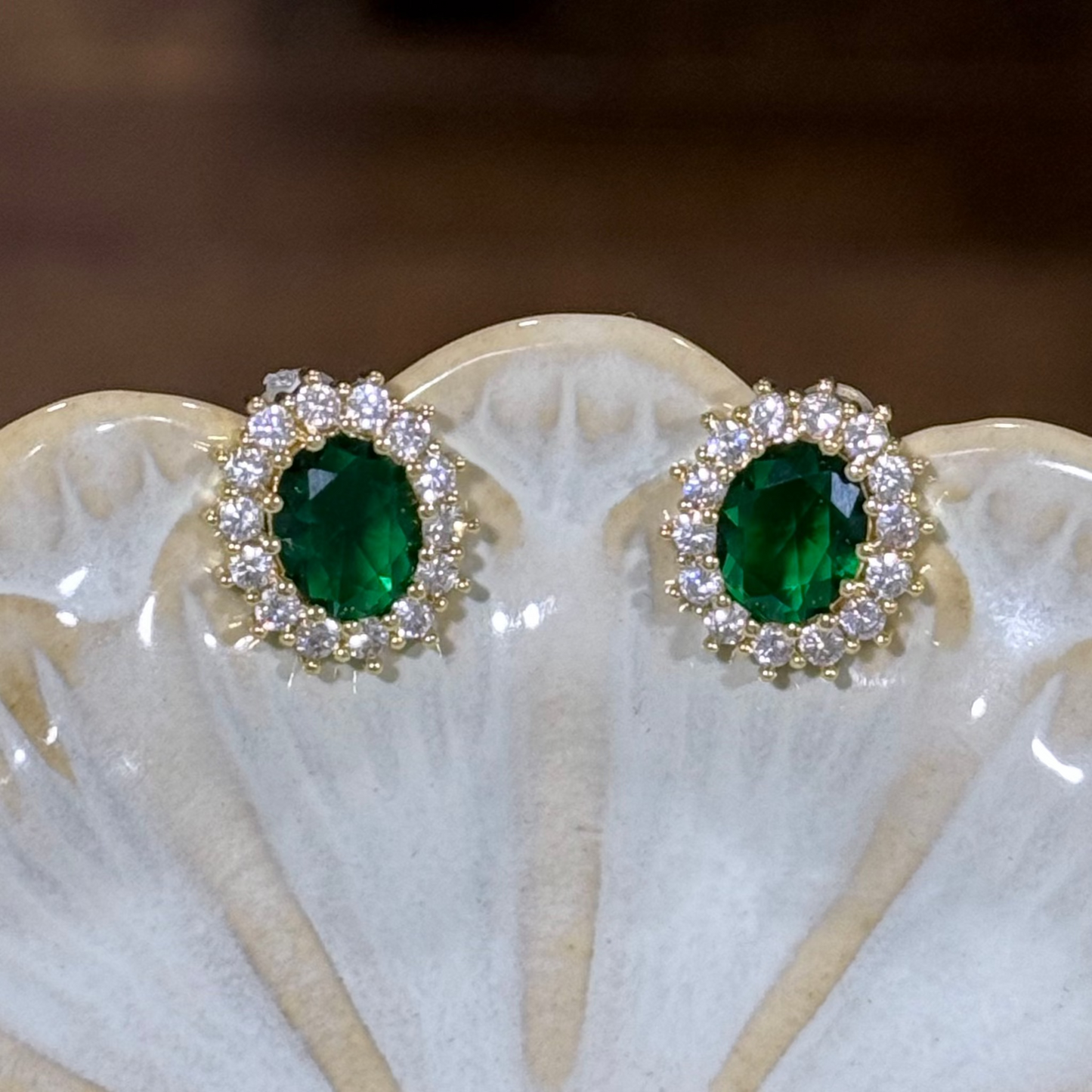 Pair of emerald green gemstone earrings with diamond accents 