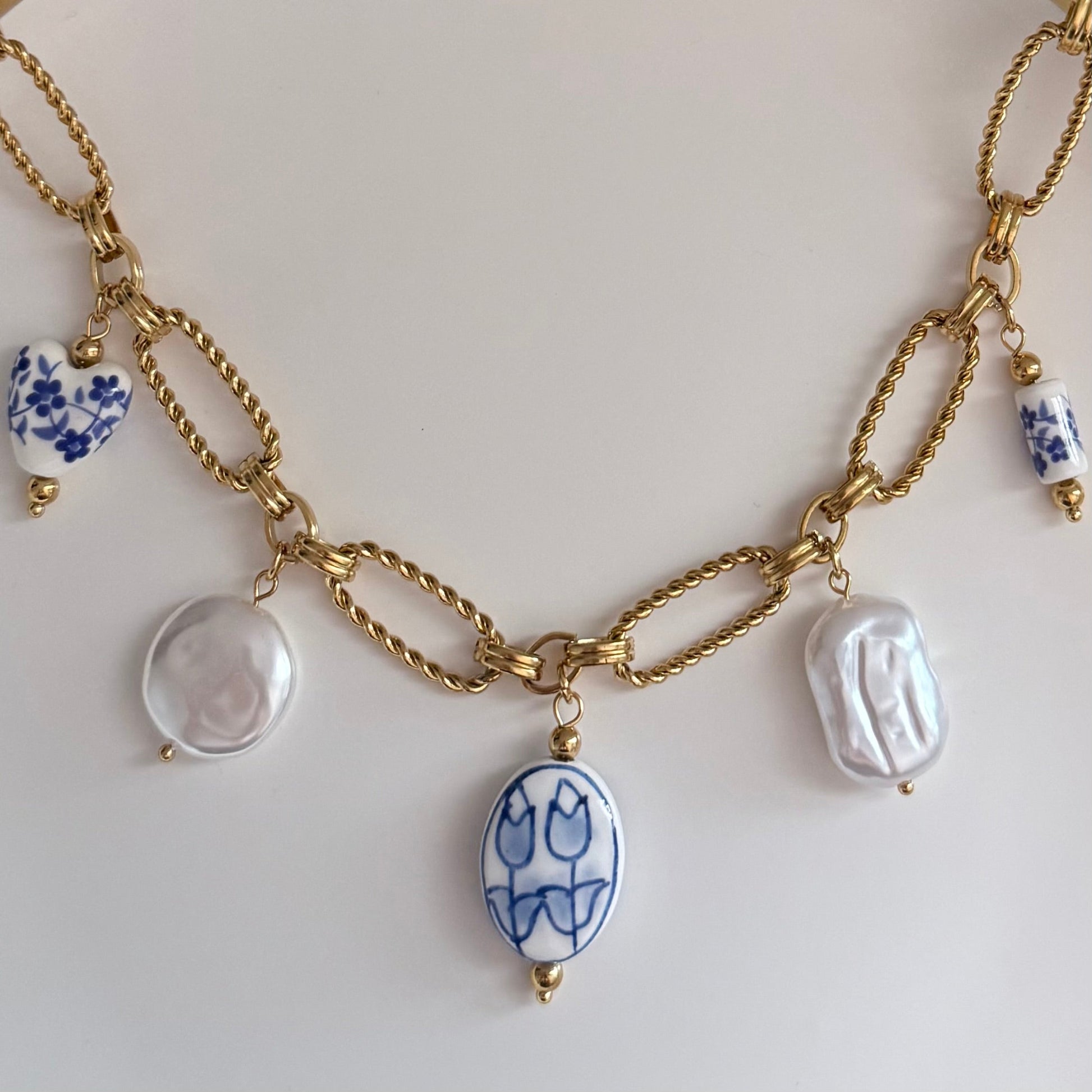 Gold Twisted paper clip chain necklace with floral charms